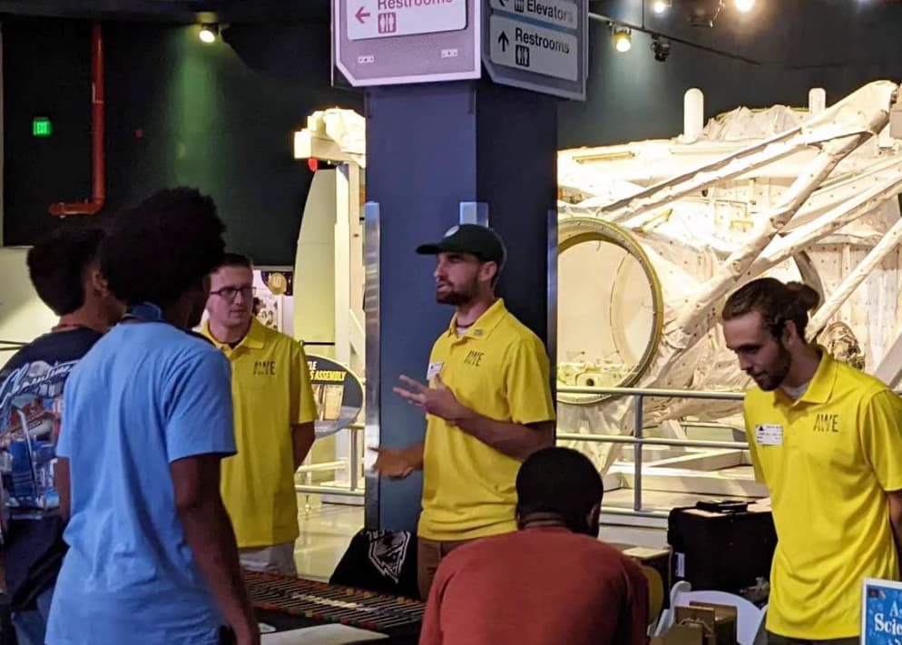 Me and two colleagues, performing AWE mission outreach at the Kennedy Space Center